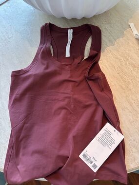 NWT Love Tank by lululemon. Perfect condition. Color is plum/burgundy.